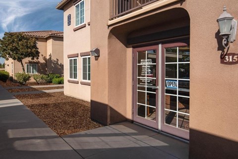 A building with a sign that says "OPEN" on the door.