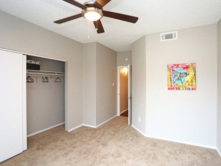 Brownstone Townhomes bedroom with a closet