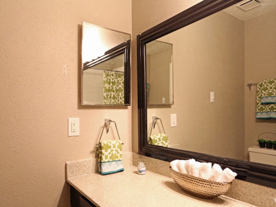 Brownstone Townhomes bathroom mirrors and counter with decor