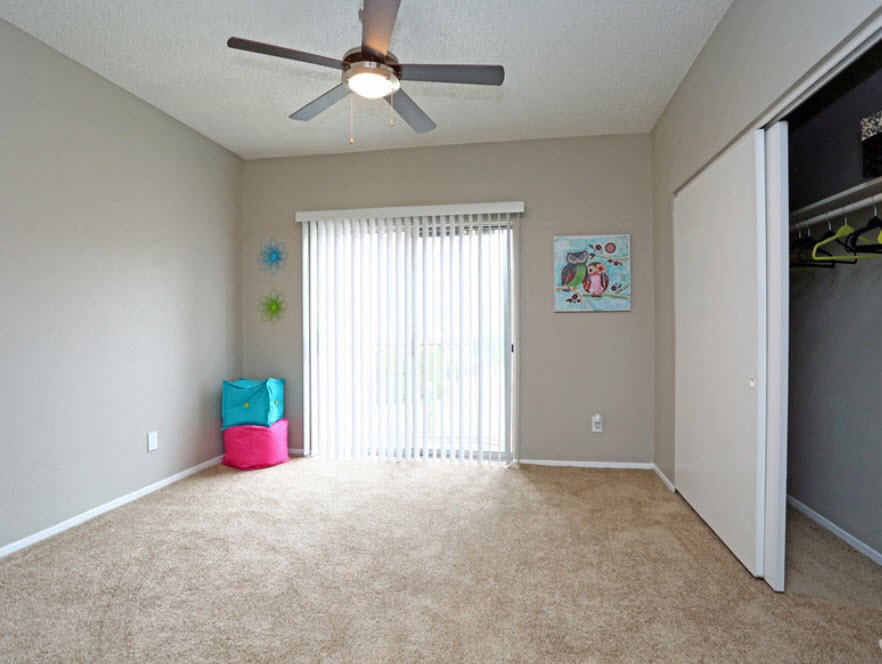 Brownstone Townhomes bedroom with closet and decor