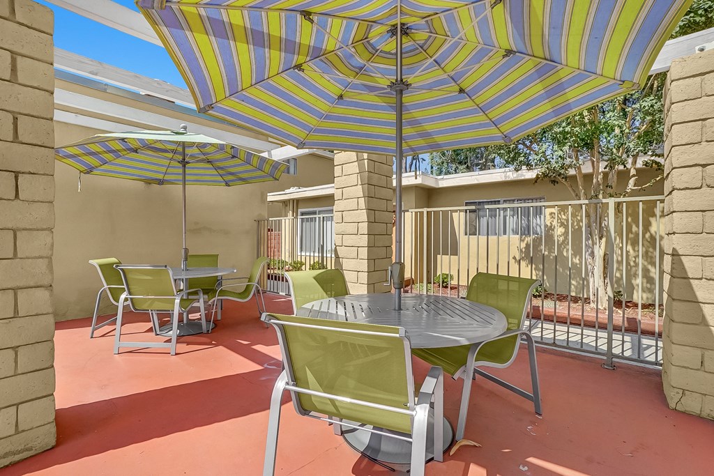 Capistrano Gardens Seating Area with chairs and umbrellas