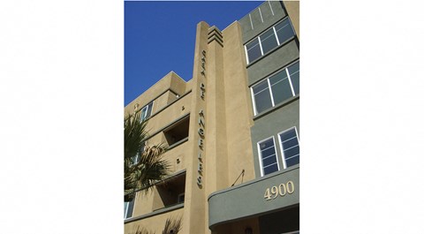 a view of a building with windows and a sign