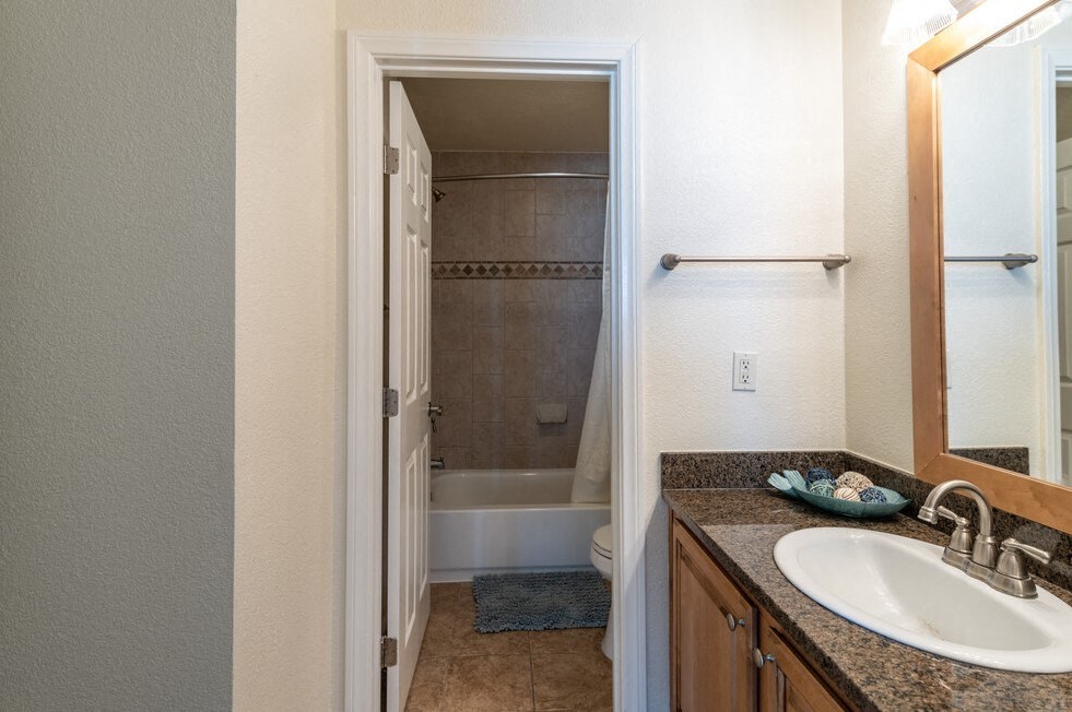 Clarington_1Bed1BathVanityAndBathroom