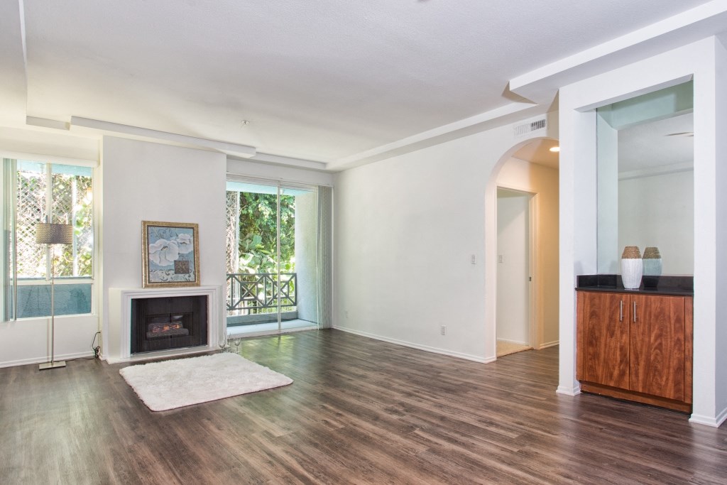 5015 Clinton Apartments unfurnished living area with fireplace