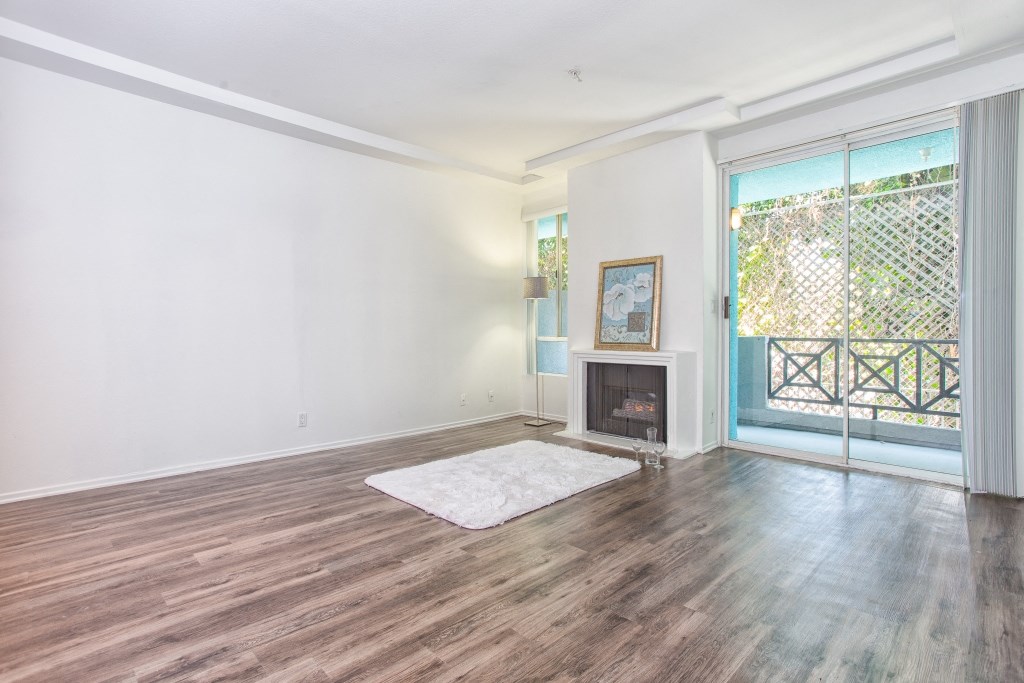 5015 Clinton Apartments unfurnished living area with fireplace