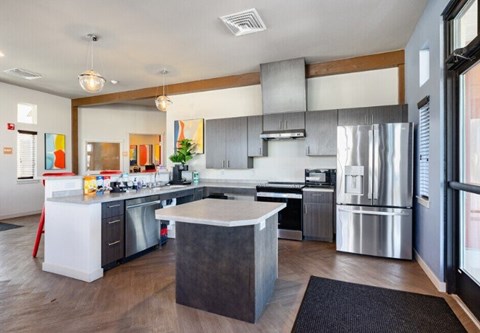 A modern kitchen with a large island in the middle.