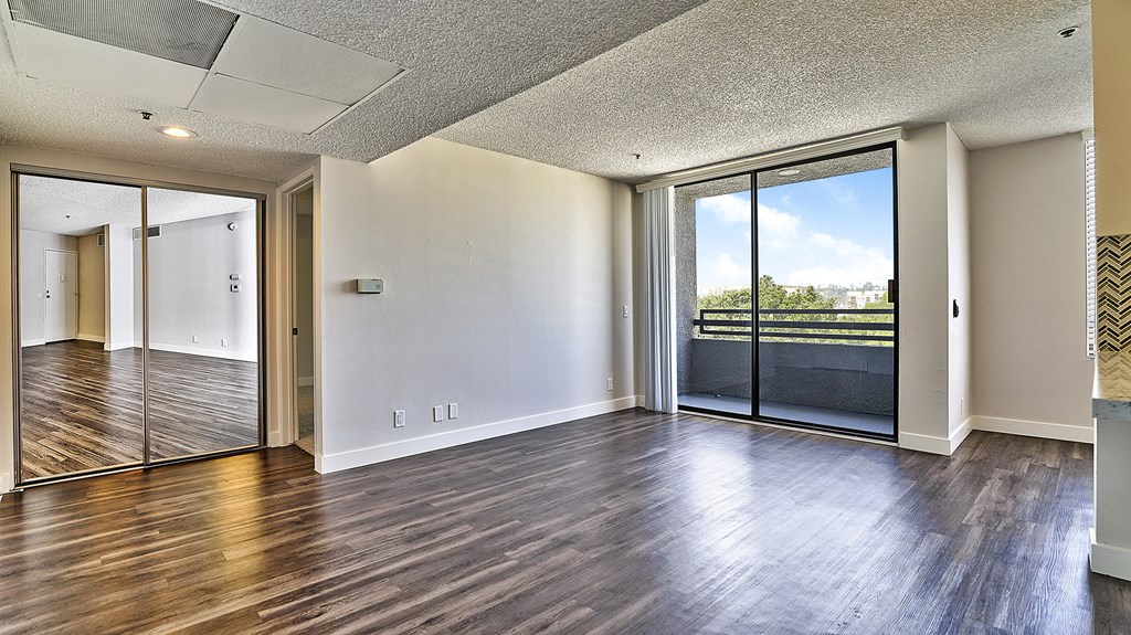 Indie Westside unfurnished living space with patio