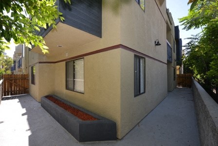Monarch Terrace exterior building walkway and planter