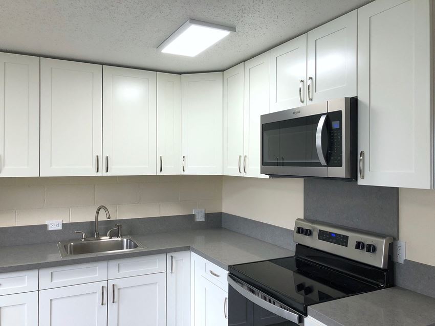 Hale Makiki Apartments kitchen area with appliances and cabinets Hale Makiki Apartments kitchen area with appliances and cabinets - Photo Gallery
