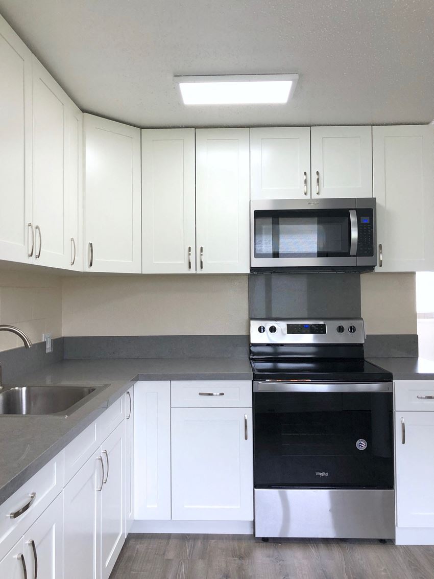 Hale Makiki Apartments kitchen area with appliances and cabinets Hale Makiki Apartments kitchen area with appliances and cabinets - Photo Gallery
