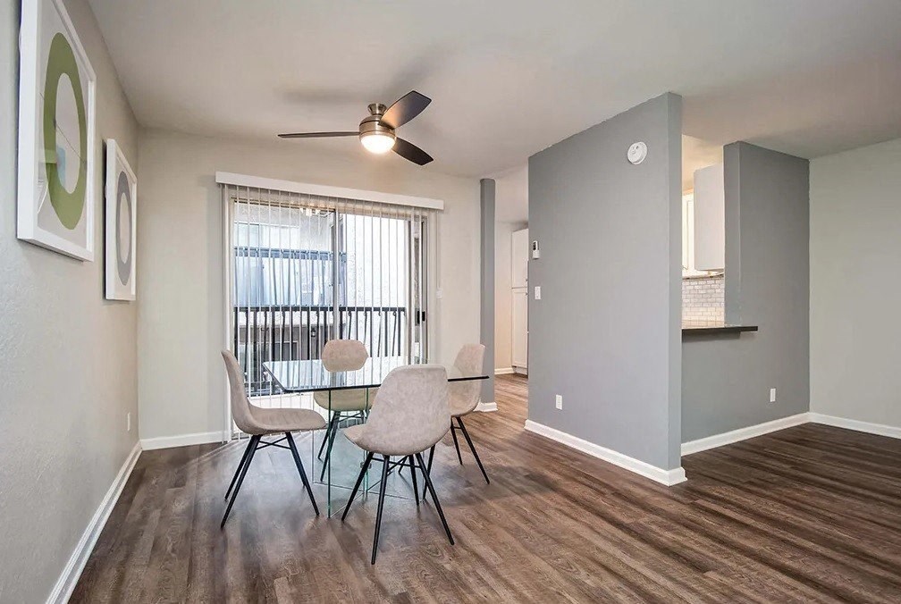 Indie Fairview dining room with a table and chairs and a ceiling fan
