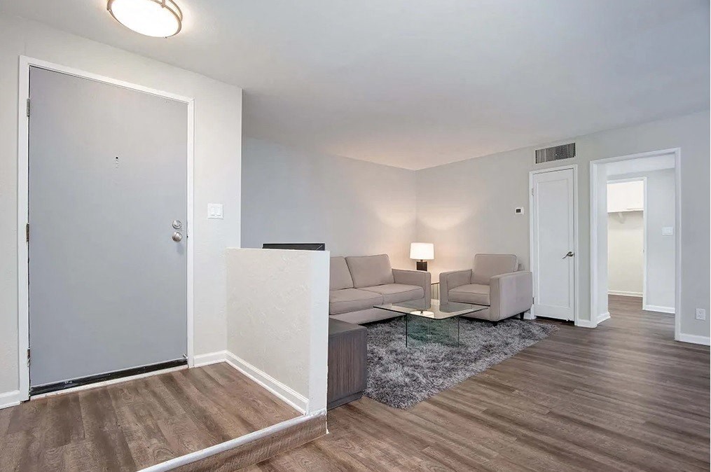 a living room with a couch and a table