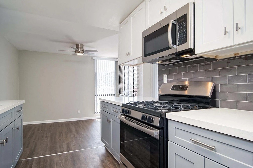 a kitchen with a stove and a microwave