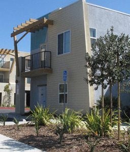 El Pedregal Apartments exterior building and planter