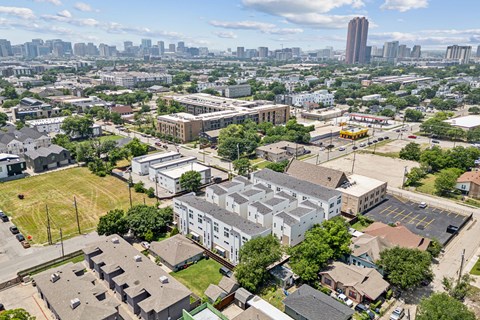 A cityscape with a mix of residential and commercial buildings.
