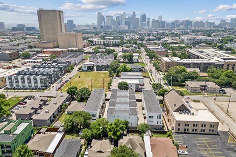 A cityscape with a mix of residential and commercial buildings.