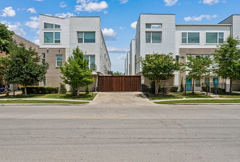 A modern residential area with a gated entrance.
