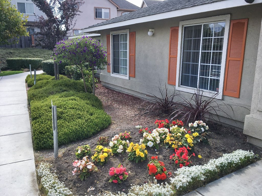 Nantucket Bay exterior with flowerbeds