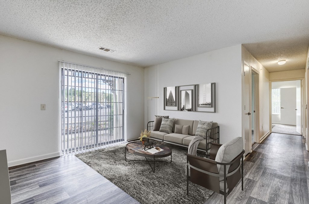 A living room with a grey couch and a coffee table.