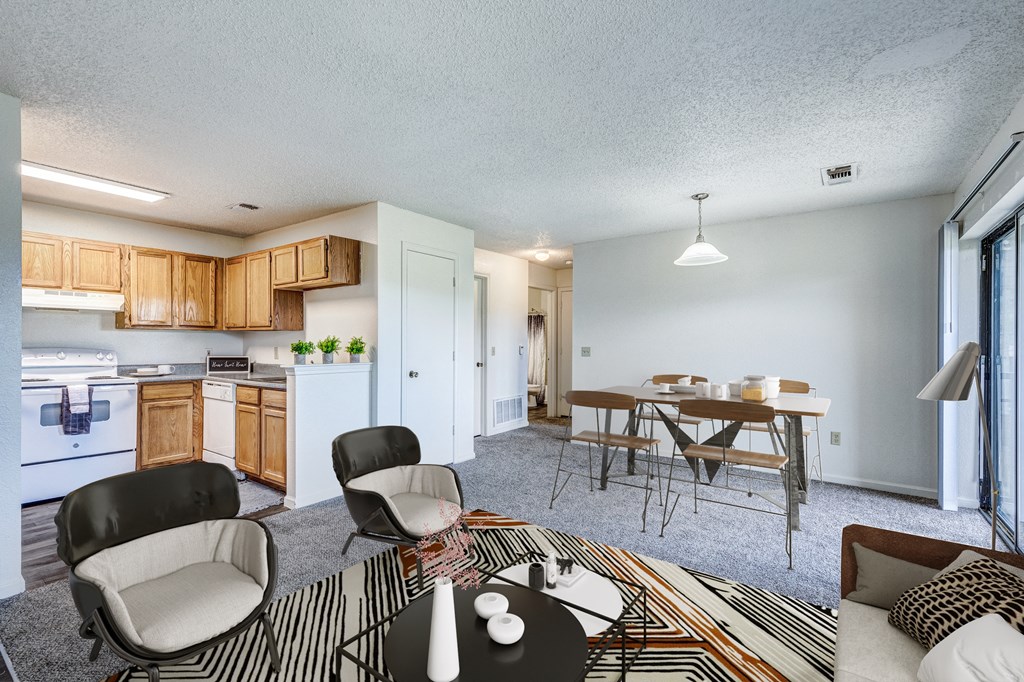 A living room with a sofa, a dining table, and chairs.