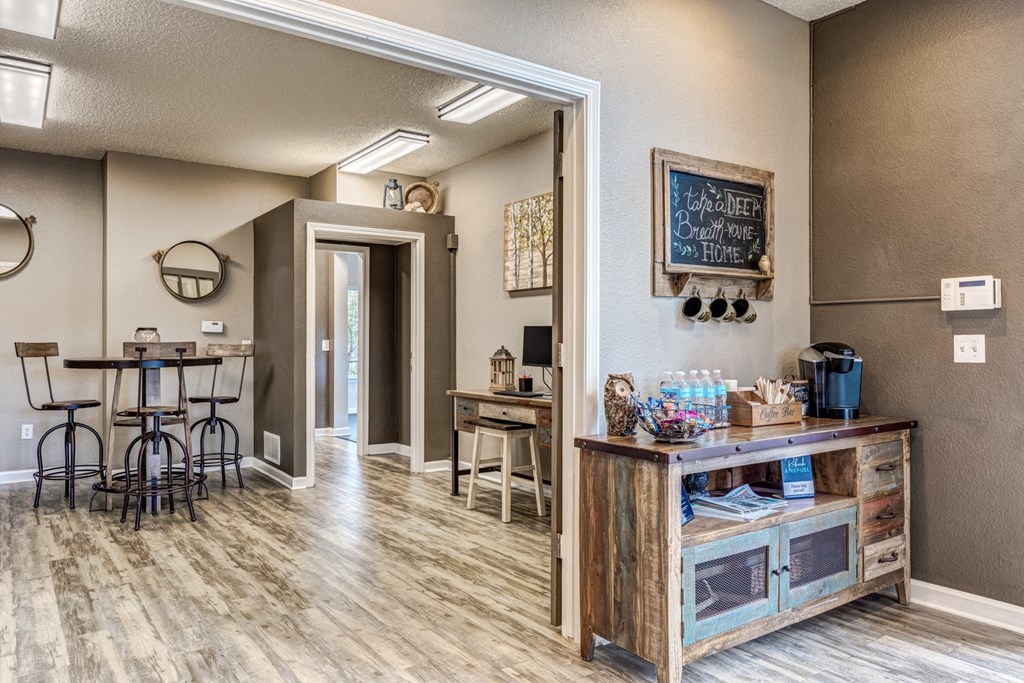 A room with a wooden table and chairs.