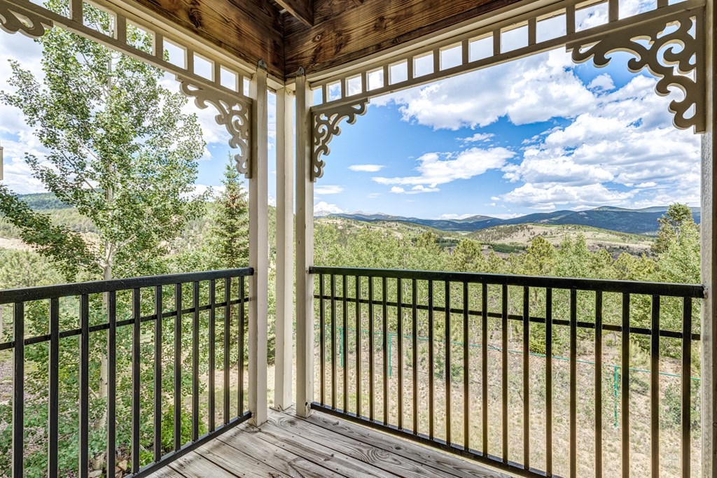 A balcony with a view of the mountains.