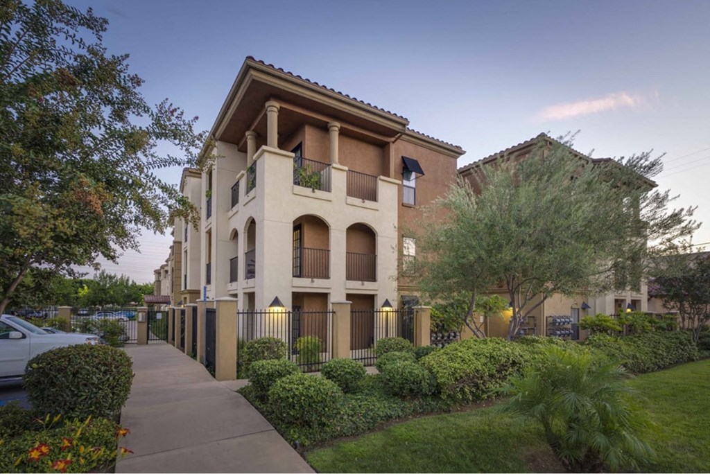 a building with a sidewalk in front of it