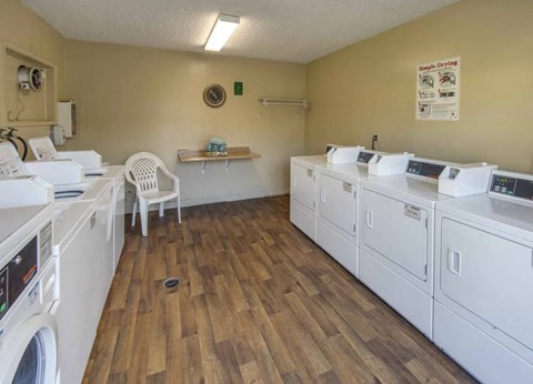 the laundry room is equipped with washes and dryers