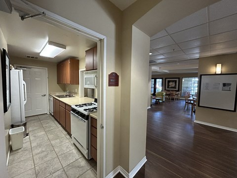 a view of a kitchen and living room from a doorway