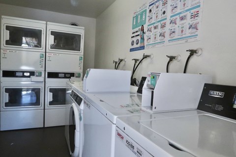 a kitchen with microwaves and stoves and a counter