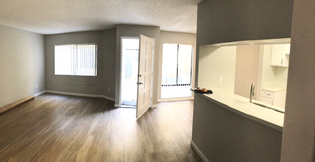 Monarch Terrace unfurnished living room and front door