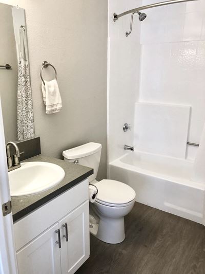 210 Garfield bathroom vanity, toilet, and shower