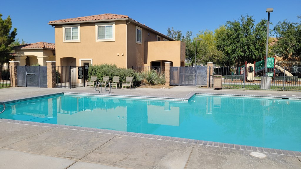 Larkspur Apartments pool with lounge chairs