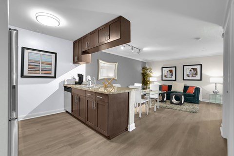 A kitchen with brown cabinets and a white countertop.