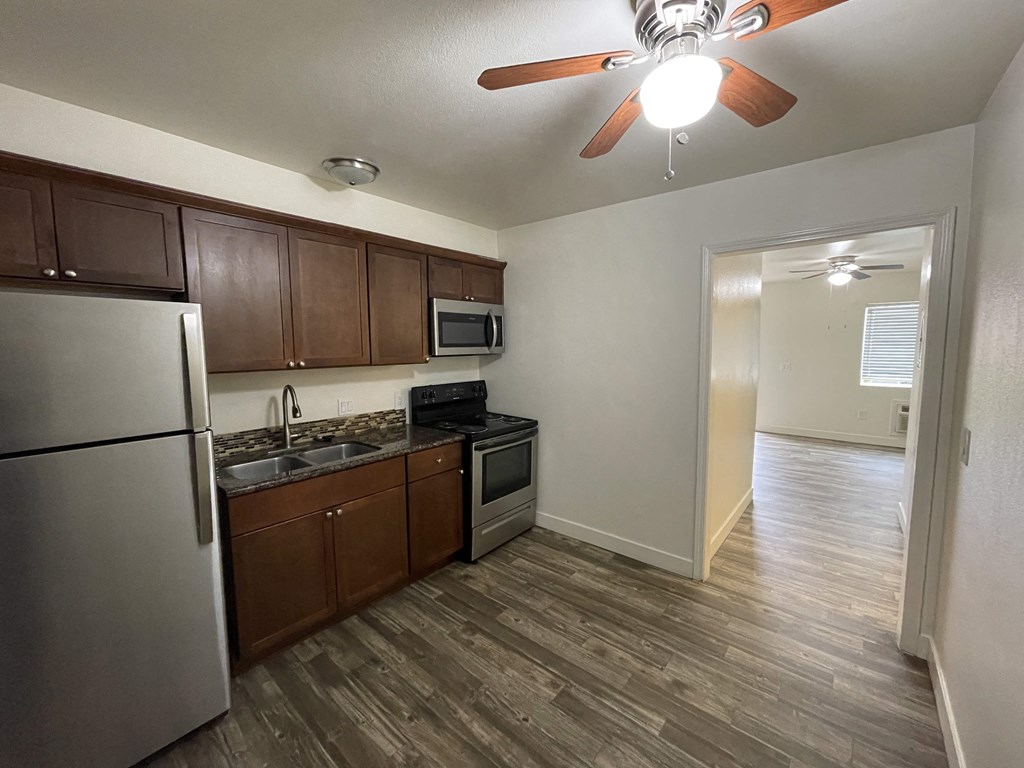 a kitchen and living room in an apartment