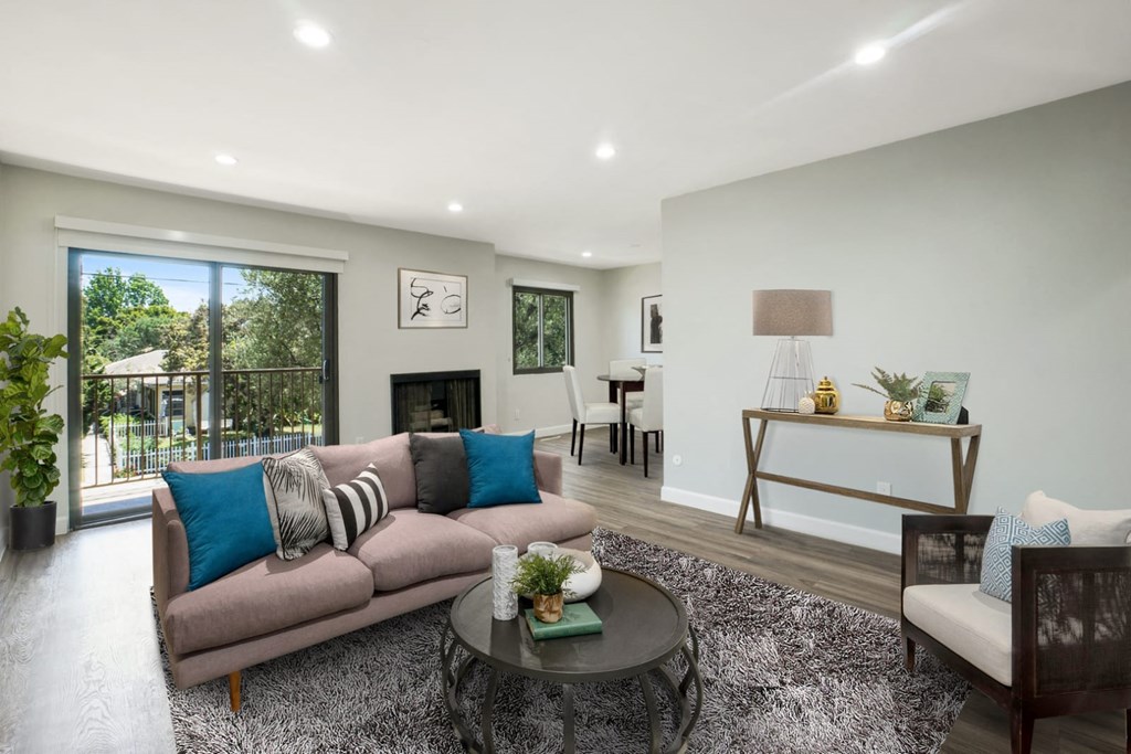 A living room with a grey couch and a coffee table.