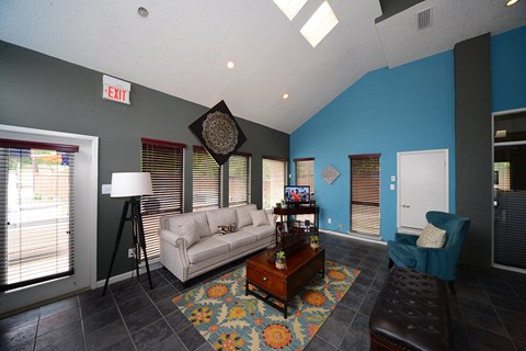 a living room with blue walls and a white couch