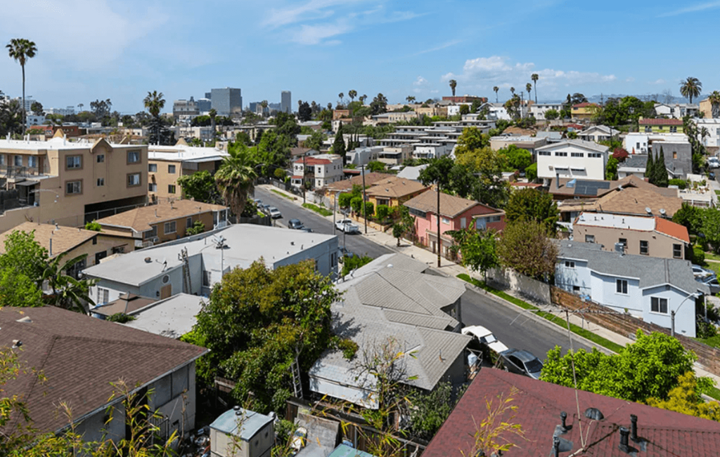 A residential area with houses and trees.