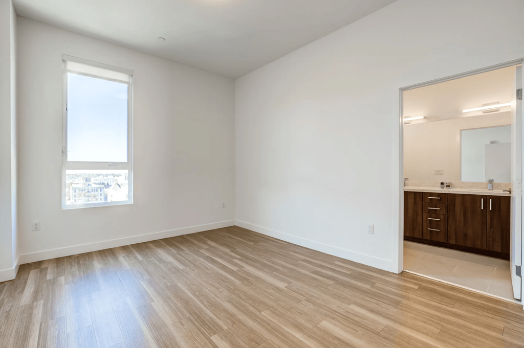 Maya Apartments bedroom with attached bathroom