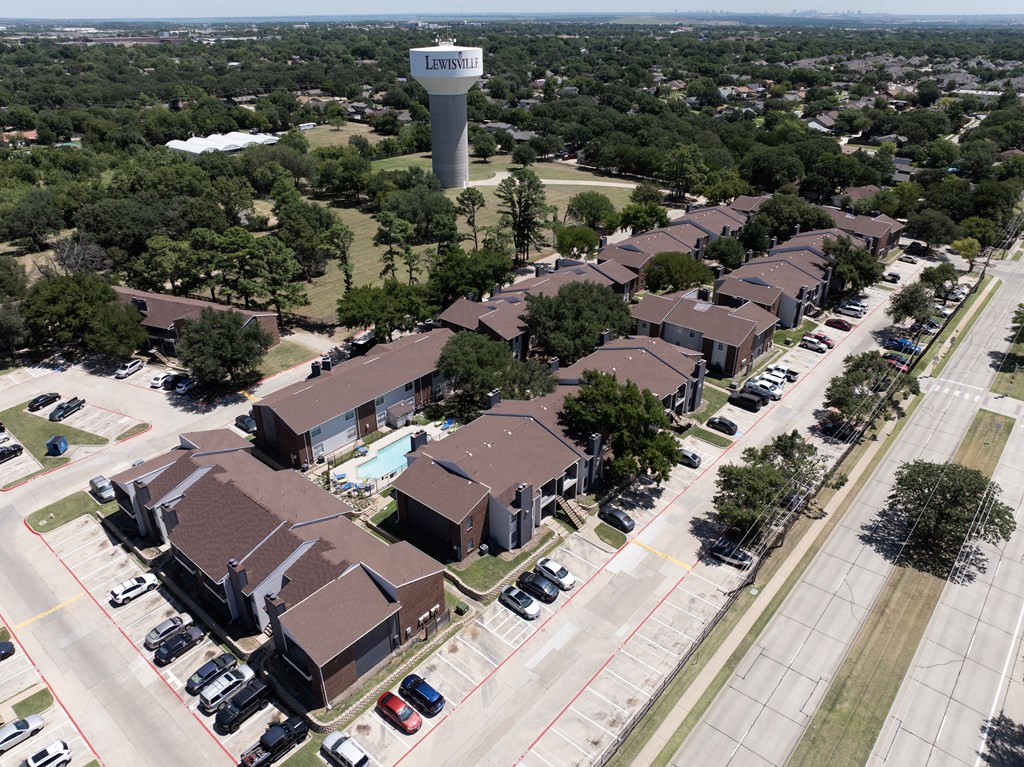 A bird's eye view of a residential area with a sign that reads "Leesburg".