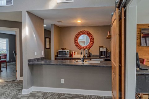 a kitchen with a counter top and a sink