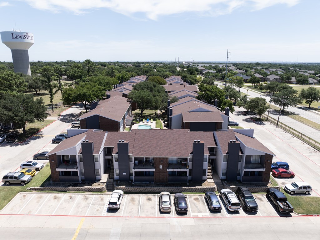 A large building complex with a water tower in the background.