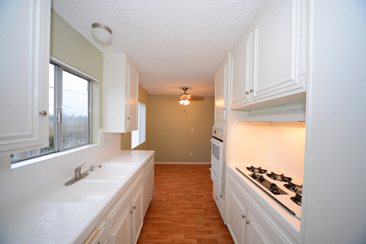 Ocean View Townhomes galley style kitchen with appliances