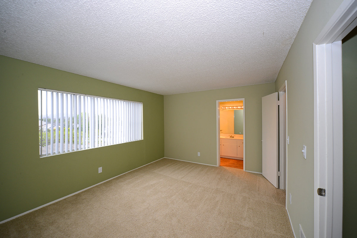 Ocean View Townhomes unfurnished bedroom with window