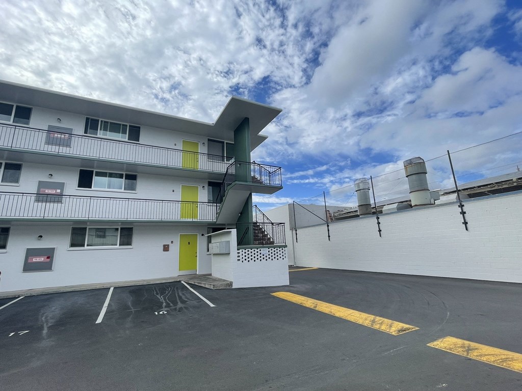 the building where the motel is located has a parking lot