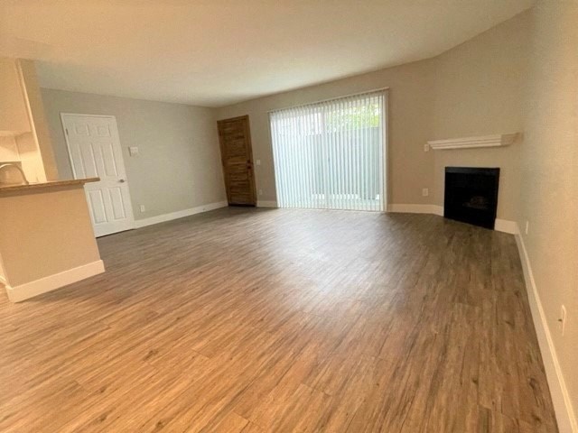 Peachgrove Apartments Living Room with Patio and Fireplace