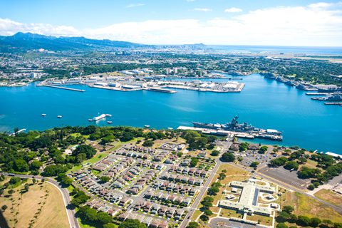 an aerial view of a marina with a city in the background