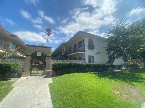 a house with a lawn and a driveway
