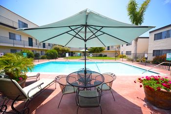 Ocean View Townhomes pool chairs and umbrella
