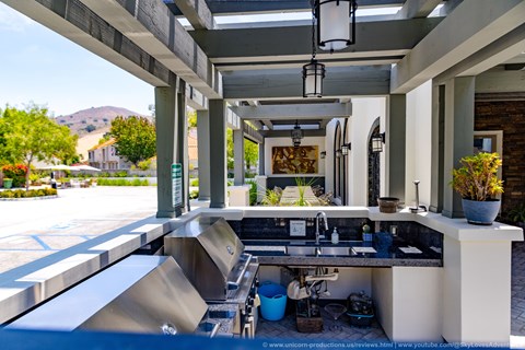A kitchen area with a sink and a counter.